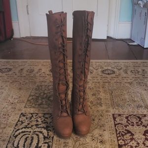 Brown lace up boats.